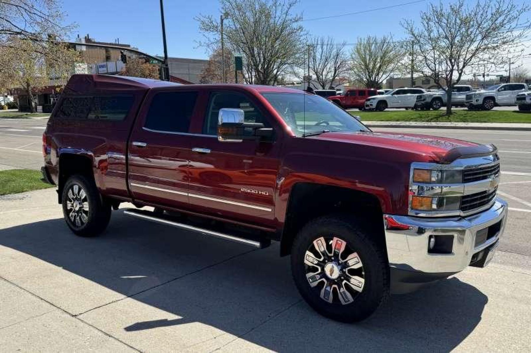 2015 Deep Ruby Metallic /Oak Chevrolet Silverado 2500 HD Crew Cab LTZ (1GC1KWEG2FF) with an V8 6.0 Liter engine, Automatic transmission, located at 2304 W. Main St., Boise, ID, 83702, (208) 342-7777, 43.622105, -116.218658 - New Wheels And Tires! Matching High Roof Shell! Well Maintained And Clean! - Photo #2
