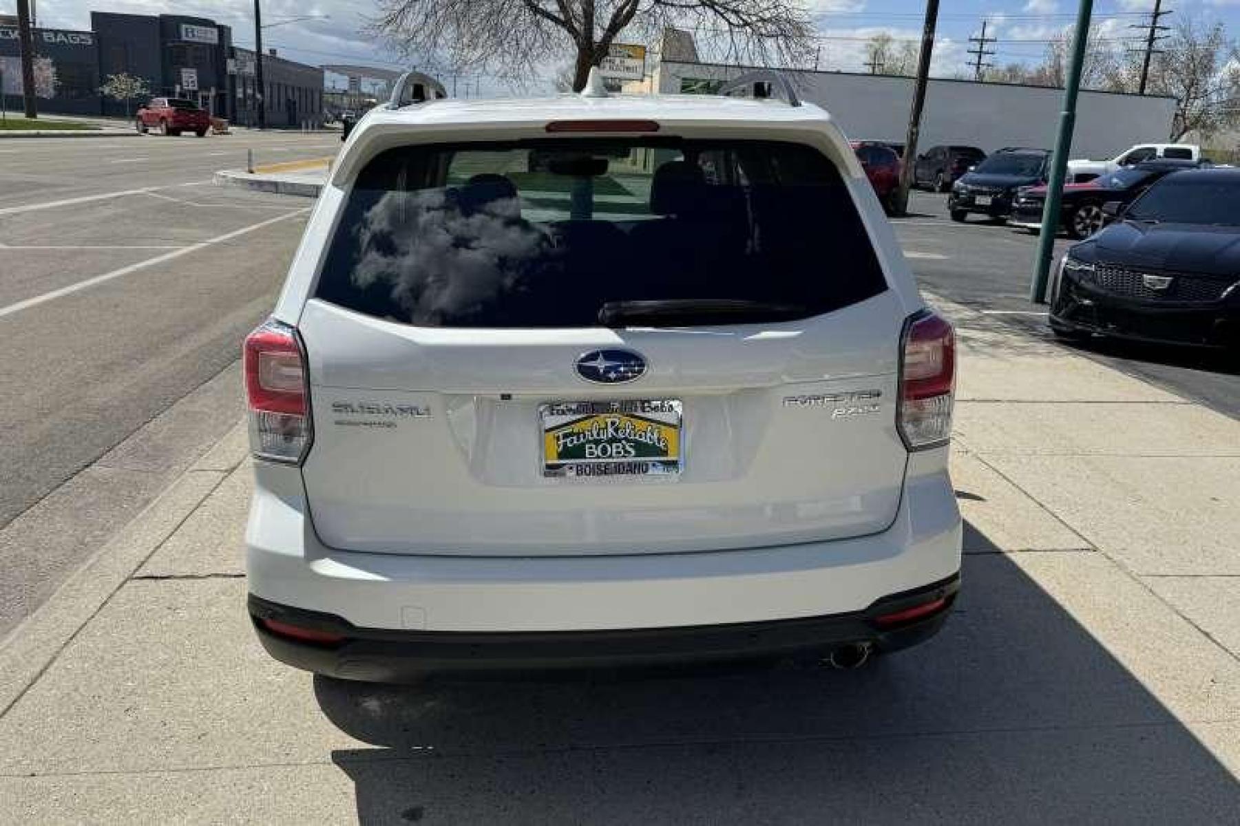2017 White /Tobacco Subaru Forester Touring (JF2SJAWC7HH) with an H4 2.5 Liter engine, Automatic transmission, located at 2304 W. Main St., Boise, ID, 83702, (208) 342-7777, 43.622105, -116.218658 - Low Mileage And Highly Optioned! Loaded With Safety Features! - Photo #1