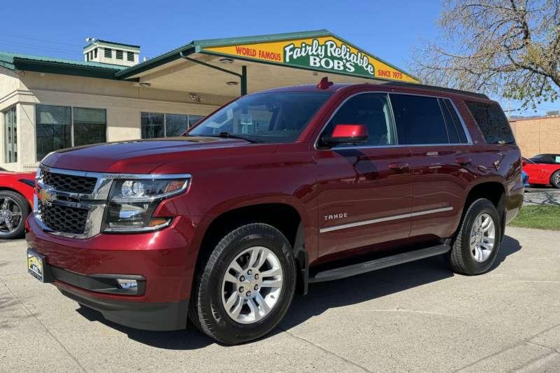 2020 Cherry Red Tintcoat /Black Chevrolet Tahoe LT (1GNSKBKC3LR) with an V8 5.3 Liter engine, Automatic transmission, located at 2304 W. Main St., Boise, ID, 83702, (208) 342-7777, 43.622105, -116.218658 - Highly Optioned! Leather! Factory DVD! Immaculate Condition! New Tires! Middle Bench Seat! A Lot Of Safety Features Too! - Photo #0