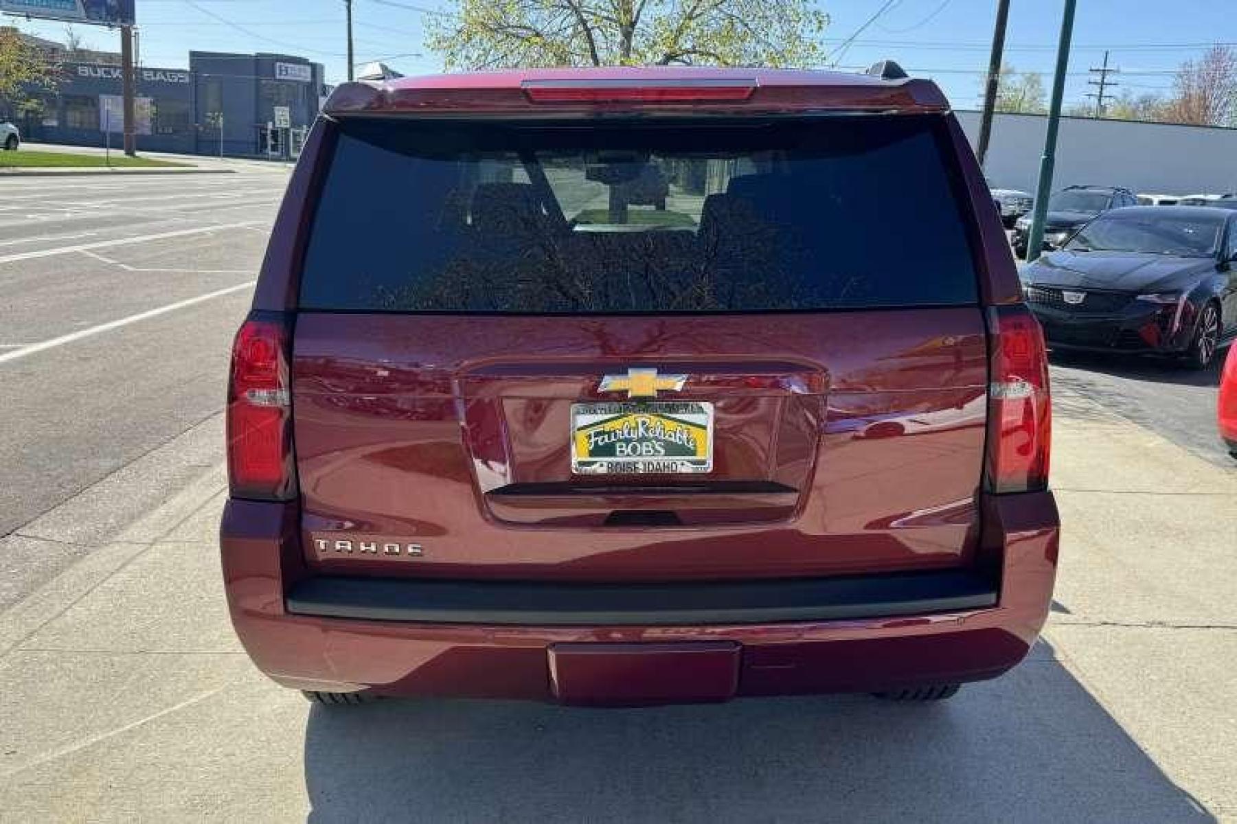 2020 Cherry Red Tintcoat /Black Chevrolet Tahoe LT (1GNSKBKC3LR) with an V8 5.3 Liter engine, Automatic transmission, located at 2304 W. Main St., Boise, ID, 83702, (208) 342-7777, 43.622105, -116.218658 - Highly Optioned! Leather! Factory DVD! Immaculate Condition! New Tires! Middle Bench Seat! A Lot Of Safety Features Too! - Photo #1