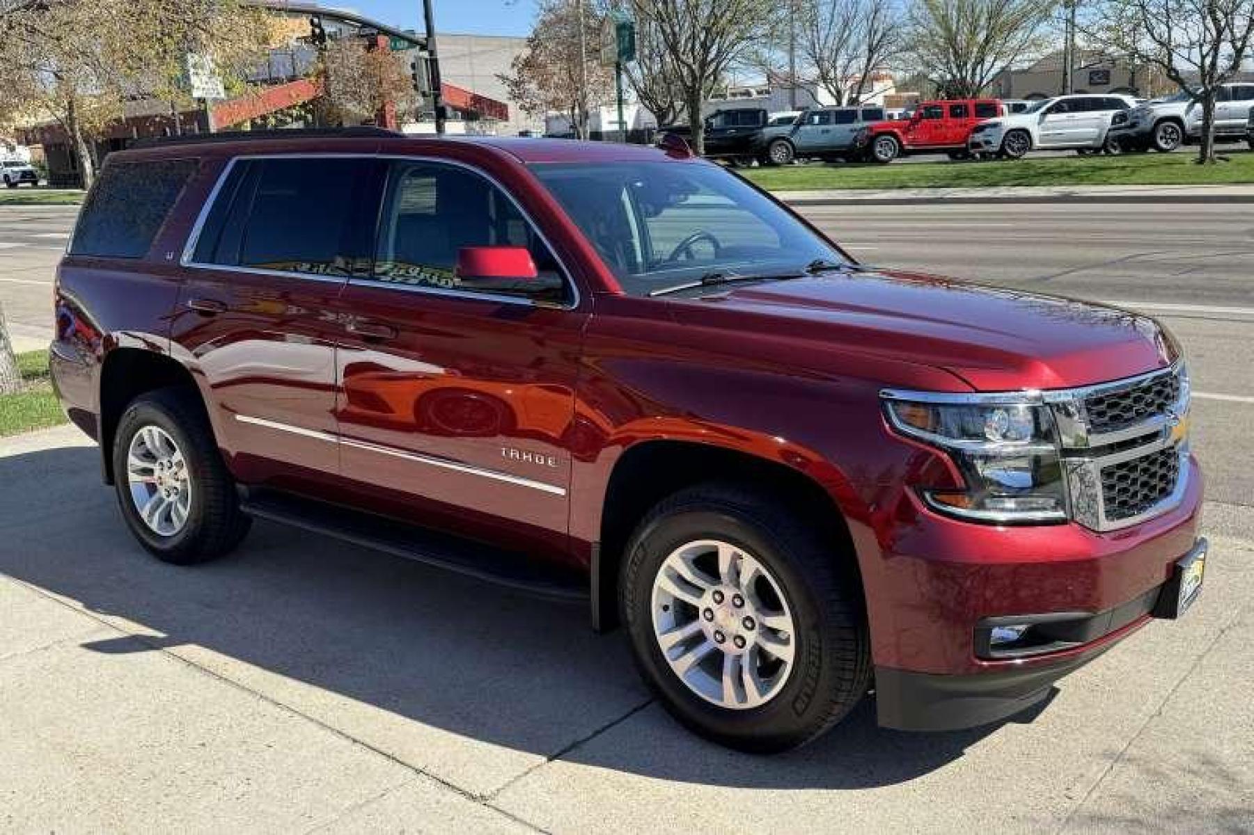 2020 Cherry Red Tintcoat /Black Chevrolet Tahoe LT (1GNSKBKC3LR) with an V8 5.3 Liter engine, Automatic transmission, located at 2304 W. Main St., Boise, ID, 83702, (208) 342-7777, 43.622105, -116.218658 - Highly Optioned! Leather! Factory DVD! Immaculate Condition! New Tires! Middle Bench Seat! A Lot Of Safety Features Too! - Photo #2