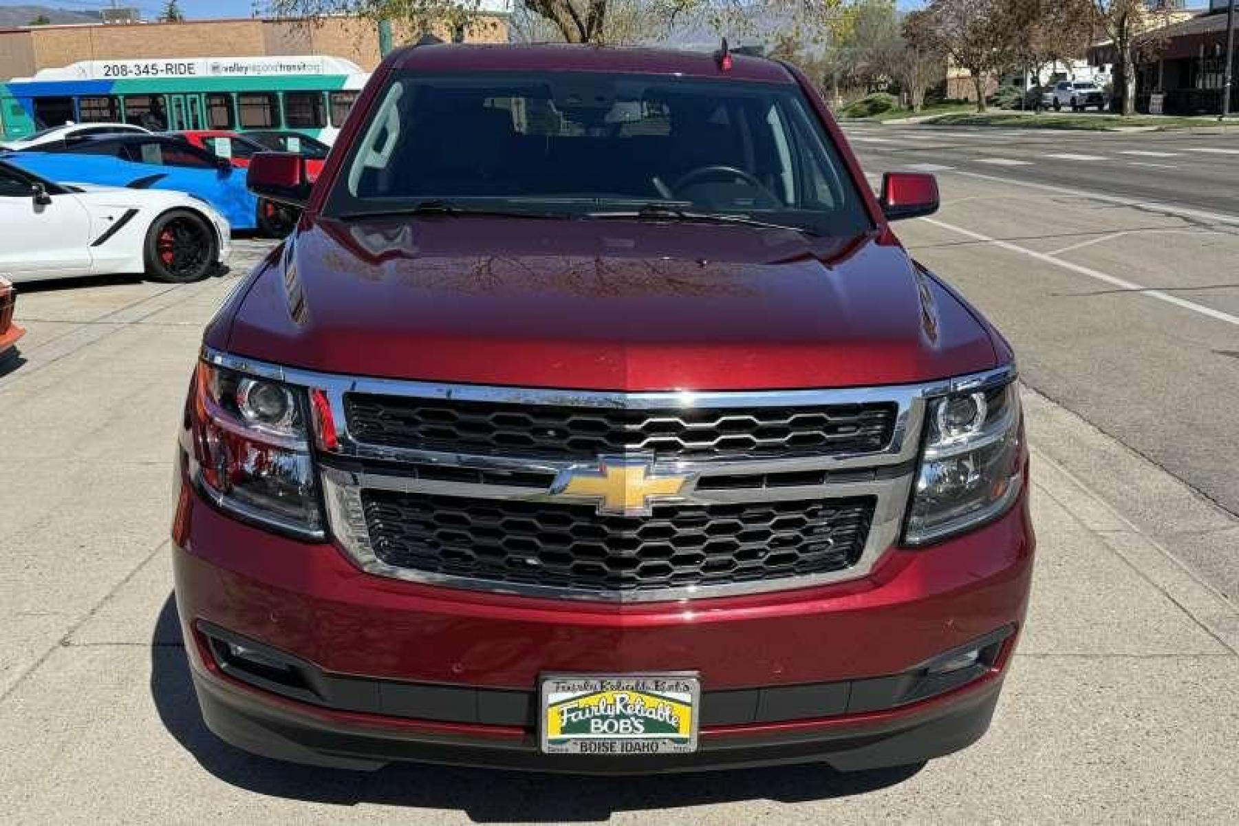 2020 Cherry Red Tintcoat /Black Chevrolet Tahoe LT (1GNSKBKC3LR) with an V8 5.3 Liter engine, Automatic transmission, located at 2304 W. Main St., Boise, ID, 83702, (208) 342-7777, 43.622105, -116.218658 - Highly Optioned! Leather! Factory DVD! Immaculate Condition! New Tires! Middle Bench Seat! A Lot Of Safety Features Too! - Photo #3