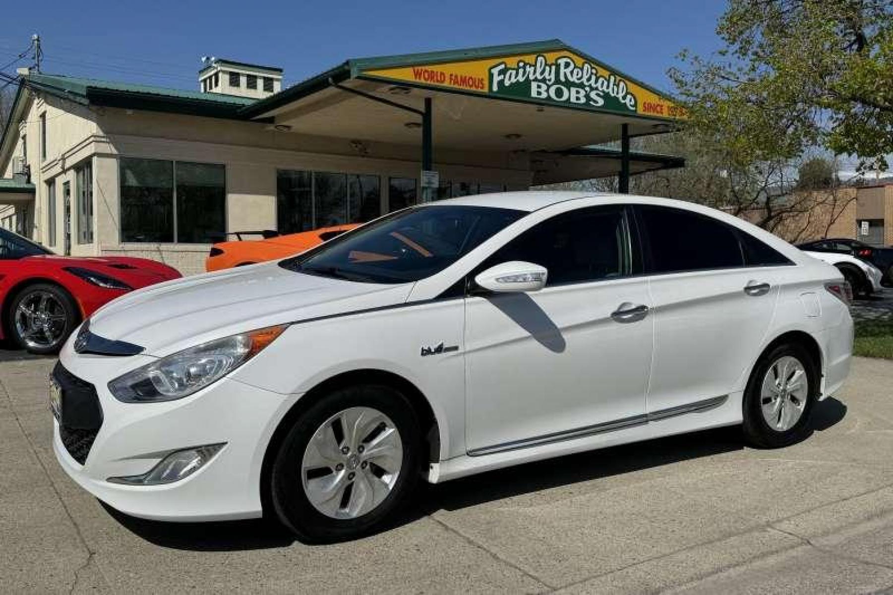 2015 Diamond White Pearl /Camel Hyundai Sonata Hybrid (KMHEC4A45FA) with an 4 Cyl 2.4 Liter Hybrid engine, Automatic transmission, located at 2304 W. Main St., Boise, ID, 83702, (208) 342-7777, 43.622105, -116.218658 - Low Mileage! New Tires! Great Fuel Economy! Smooth Ride! - Photo #0