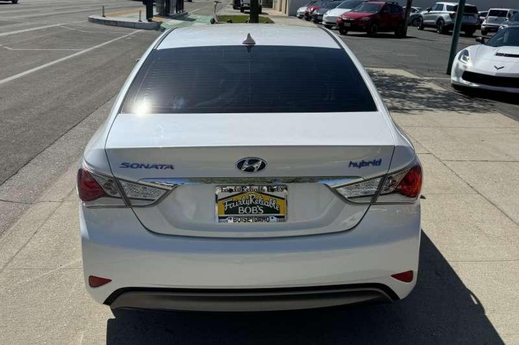 2015 Diamond White Pearl /Camel Hyundai Sonata Hybrid (KMHEC4A45FA) with an 4 Cyl 2.4 Liter Hybrid engine, Automatic transmission, located at 2304 W. Main St., Boise, ID, 83702, (208) 342-7777, 43.622105, -116.218658 - Low Mileage! New Tires! Great Fuel Economy! Smooth Ride! - Photo #1