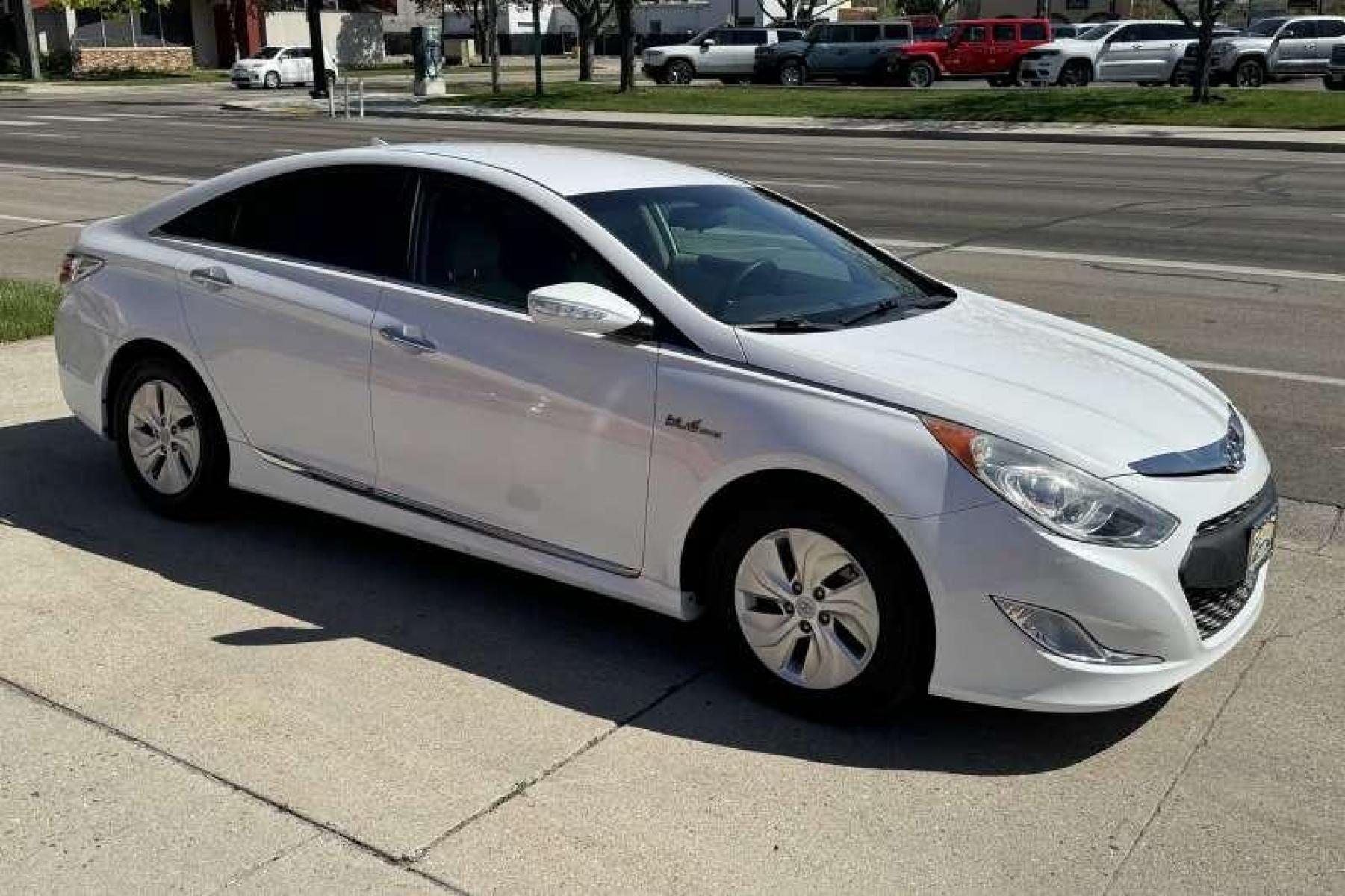 2015 Diamond White Pearl /Camel Hyundai Sonata Hybrid (KMHEC4A45FA) with an 4 Cyl 2.4 Liter Hybrid engine, Automatic transmission, located at 2304 W. Main St., Boise, ID, 83702, (208) 342-7777, 43.622105, -116.218658 - Low Mileage! New Tires! Great Fuel Economy! Smooth Ride! - Photo #2