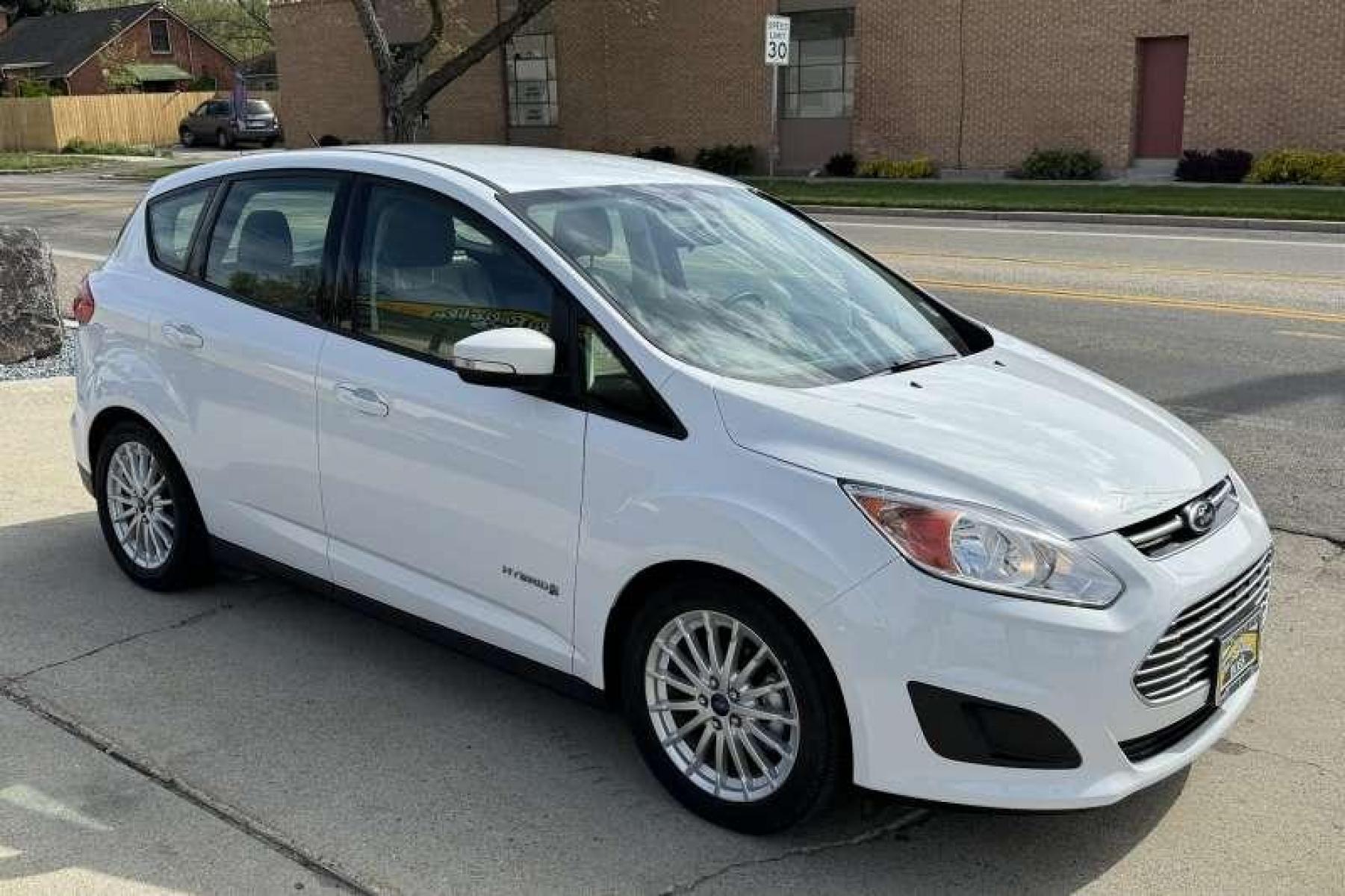 2014 Oxford White /Oak Ford C-Max Hybrid SE Hatchback (1FADP5AU1EL) with an 4 Cyl 2.0 Liter Hybrid engine, Automatic transmission, located at 2304 W. Main St., Boise, ID, 83702, (208) 342-7777, 43.622105, -116.218658 - Incredibly Low Mileage! New Tires! Ready To Go! - Photo #2